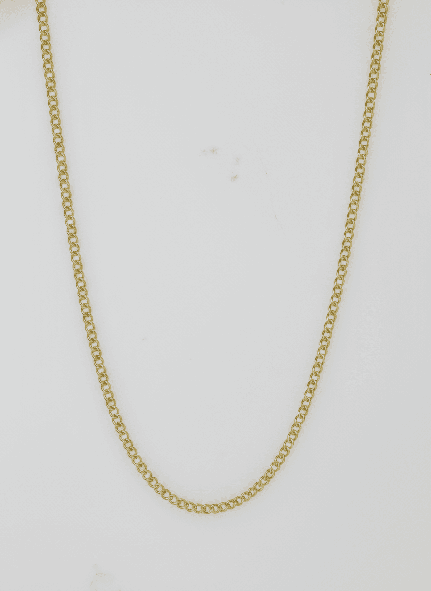A jewelry piece photographed on a phone